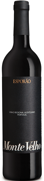 Taça de vinho Monte Velho Tinto Magnum da Esporão em grande formato, destaque para a garrafa de vinho tinto.