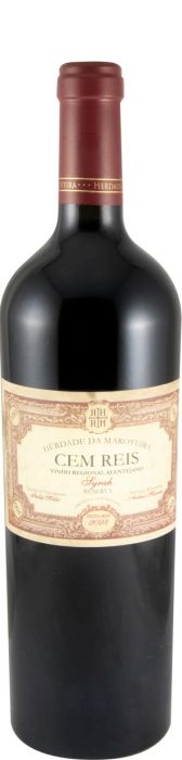 Taça de vinho tinto Cem Reis da Herdade da Maroteira, destaque para a cor rubi e detalhes do vinho na taça.