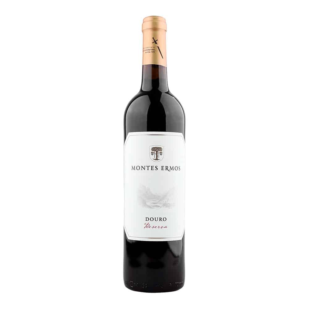 Taça de vinho tinto Montes Ermos Reserva 2021, produzido pela Adega Cooperativa de Freixo de Espada à Cinta.