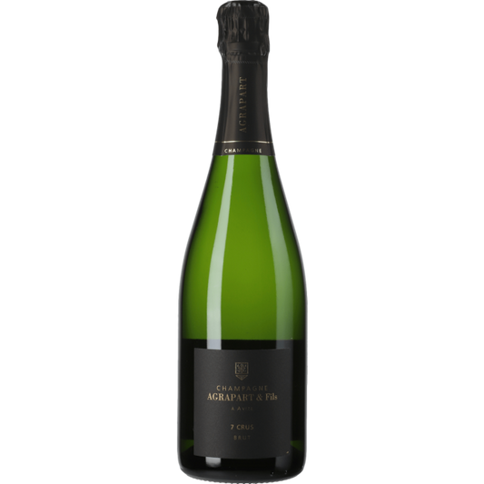 Taça de Champagne Agrapart 7 Crus, bebida espumante de alta qualidade, em taça transparente com detalhes de bolhas e coloração dourada