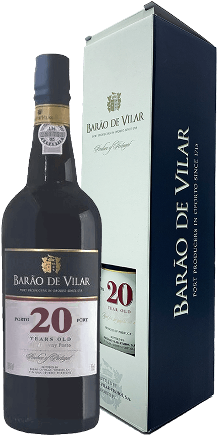 Taça de vinho do Porto Barão de Vilar 20 Anos com garrafa de vinho na mesa, destaque para o rótulo.