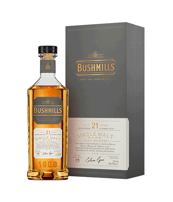 Whisky Bushmills 21 anos, destilado de malte e grão, envelhecido em barris, apresentado na garrafa com rótulo dourado.