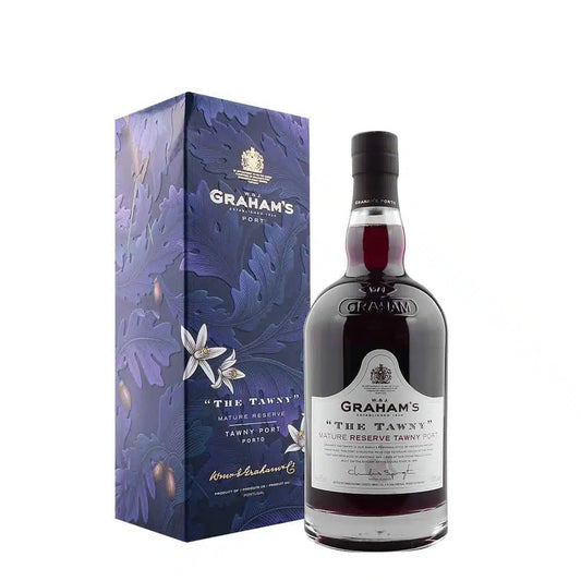 Taça de vinho do Porto Graham’s Tawny Reserva da Symington, com cor âmbar e aroma frutado, em taça de degustação.