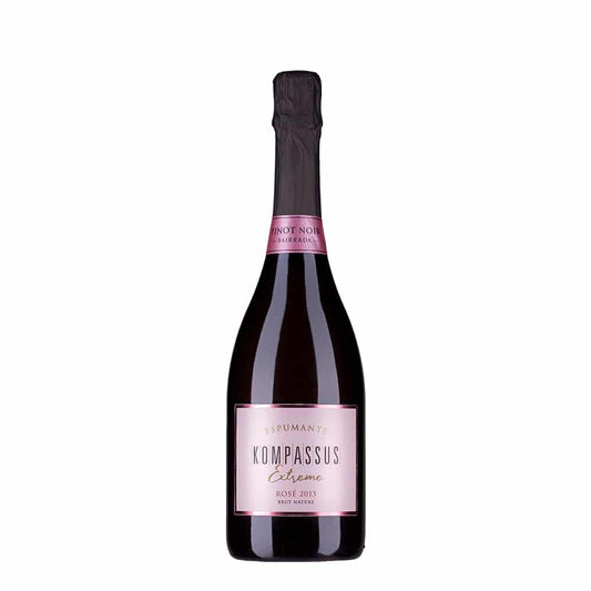 Espumante Kompassus Extreme Pinot Noir Rosé na taça, com cor rosada vibrante e borbulhas finas, em fundo neutro.