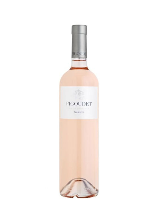 Taça de vinho rosé Pigoudet Premier Rosé, garrafa de vinho da marca Pigoudet, com rótulo elegante e cor rosada vibrante.