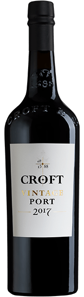 Taça de vinho do Porto Croft Vintage 2017, garrafa de vinho tinto envelhecido, destaque na imagem.
